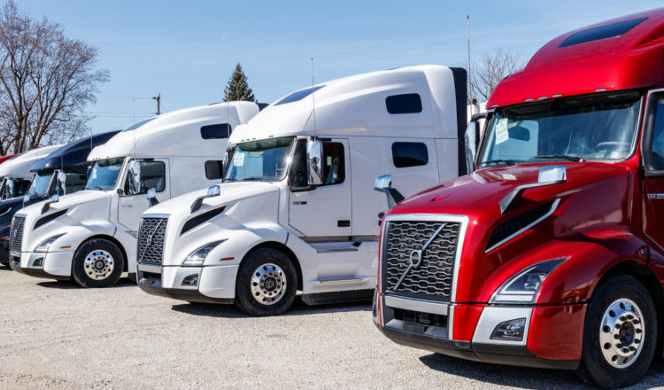 Muncie - Circa March 2019: Colorful Volvo Semi Tractor Trailer Trucks Lined up for Sale. Volvo is one of the largest truck manufacturers V